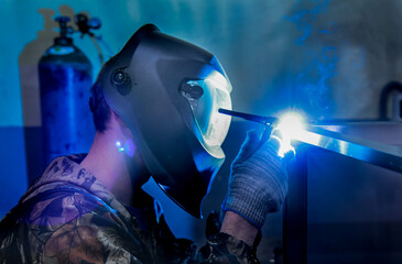man working with a welding machine