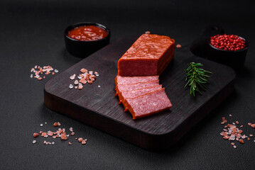 Delicious fresh sausage salami with salt, tomatoes and spices