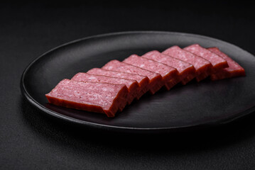 Delicious fresh sausage salami with salt, tomatoes and spices