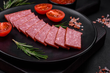 Delicious fresh sausage salami with salt, tomatoes and spices