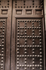 Vintage door with trim ornaments and forged metal details