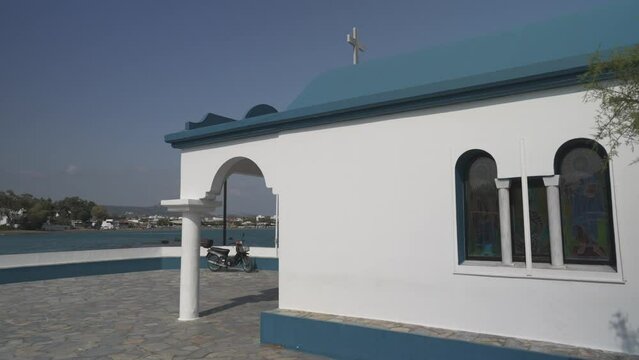 Little white chapel in Faliraki Harbour, Faliraki, Rhodes, Dodecanese Islands, Greek Islands, Greece, Europe