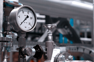 A new manometer with new valves installed in an additive pumping station with pipelines on the...