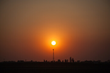 Red sunset over the field