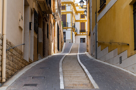 Narrow cobbled street in Polop town, Alicante, Spain