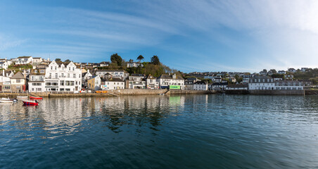 Naklejka premium View of the pretty historic Cornish fishing village of Polperro with the harbor, fishing boats and fisherman cottages in sunshine