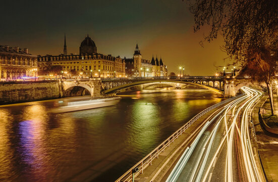The City of Love: A breathtaking view of a river and bridge with the iconic Eiffel Tower as the backdrop