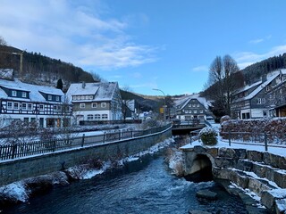 Snow covered town and wood near the german town of Winterberg in province Sauerland, Germany