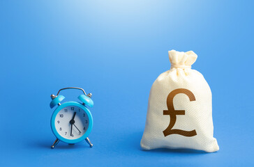 Time clock and british pound sterling money bag. Loans, mortgages. Retirement funds. ROI. Bonds,...