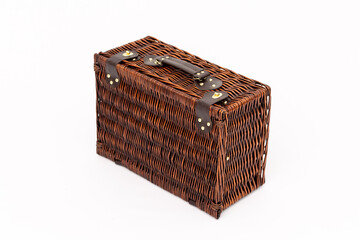 The wicker picnic suitcase on white background
