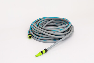 plastic gray hose for irrigation on a white background