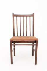 The vintage wooden brown chair with upholstered seat