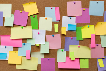Post blank stickers on cork bulletin board. Concept of business notes.