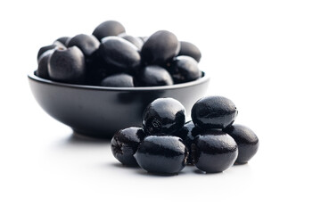 Pitted black olives isolated on white background.
