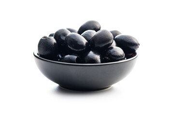 Pitted black olives in bowl isolated on white background.