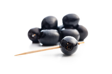 Pitted black olives isolated on white background.