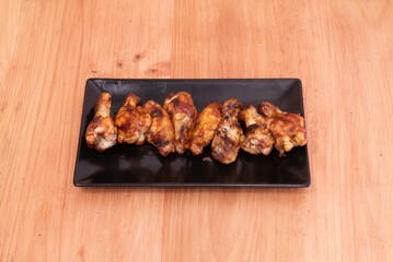 Sweet or Chinese chicken wings are a sweet dish of chicken wings seasoned with soy sauce served in some Hong Kong restaurants