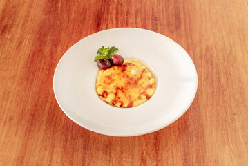 Catalan cream is made with egg yolk, sugar, wheat flour or corn flour and milk flavored with cinnamon and lemon peel