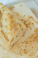 bread a staple food that is part of the traditional diet in Europe, the Middle East, India, America and Oceania. It is prepared by baking a dough, made with cereal flour, water and salt