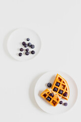 Breakfast table. Waffle and blueberry. Flat lay.