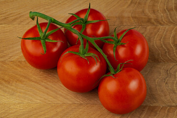 branch of ripe tomatoes, ripe red tomatoes