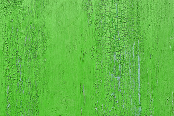 Abstract background of cracked weathered old wood with layers of paint