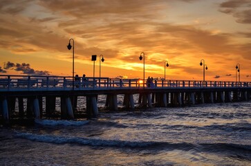 Obraz premium Beautiful morning seaside landscape. Popular pier in Gdynia, Poland at sunrise.