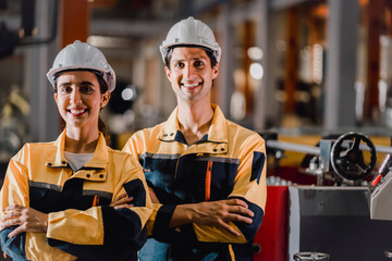factory engineering manager teaching female mechanic trainee for job training and apprentice. young...