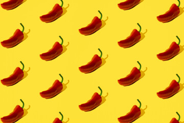 Red pepper on a yellow pastel background.