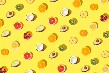 Colorful fruit on a yellow background. Modern design and pattern.
