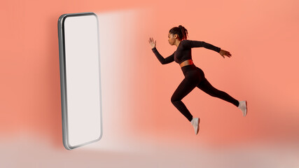 Fototapeta na wymiar Fitness application. Black lady running to big smartphone with blank screen over neon colored background, panorama