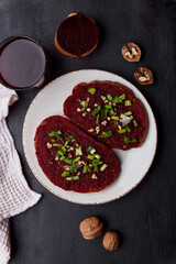 Vegan beetroot spread sandwiches with young onion, garlic and cottage cheese. Vegetarian seasonal food flat lay.