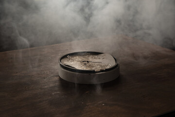 Old and vintage blank clock dial without hand on old wooden table