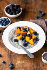 Chia pudding with berry fruits and peach