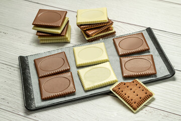 Butter biscuit cakes with white and brown milk chocolate