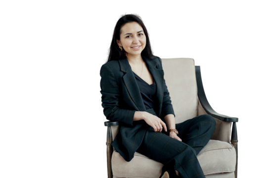 A young woman in a business suit on a chair, transparent background, png, isolated. - Powered by Adobe