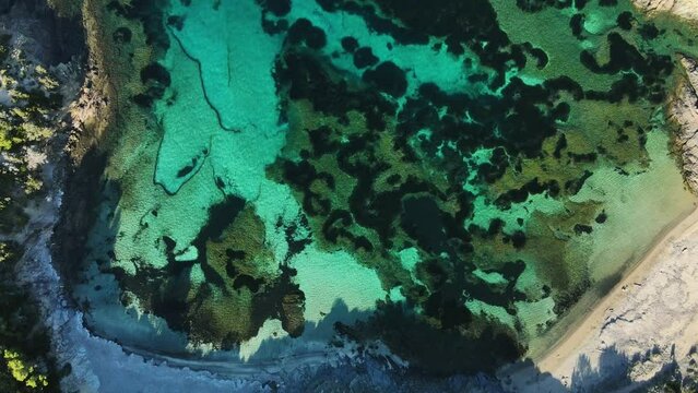 Birds Eye View of shallow reef system along the coastline of Cala Torret in Menorca, Spain