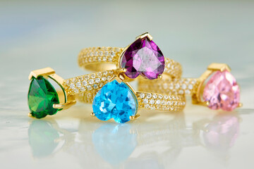 Diamond jewelry. Diamond colors rings on background