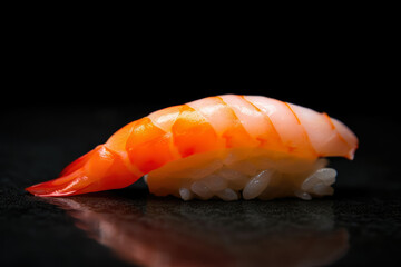 mouthwatering macro shot of a shrimp nigiri sushi with a slice of lemon on top, generative ai
