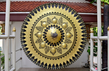Closeup of Large gong with Thai gold pattern Located in a Thai Buddhist temple with decoration,...