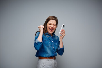 Happy excited woman with closed eyes say Yes using smartphone. Isolated portrait.