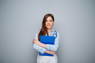 Smiling doctor woman  holding clipboard or notepad, isolated portrait with copy space.