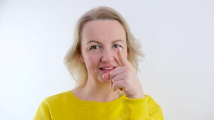 woman made choice she shows finger in frame at beginning she shakes head negatively no way I will not have new idea it will be exactly as I said domineering teacher mom wife relations of people