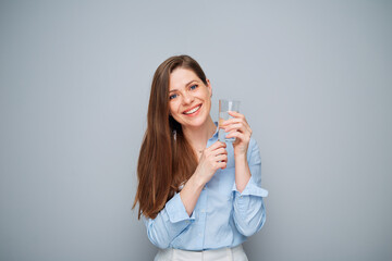 Happy business woman holding water glass.