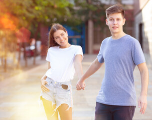 Teenagers are communicating on walk on the street