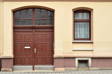 Fototapeta na wymiar View of old building with wooden door and window