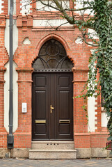 Fototapeta na wymiar View of brick building with wooden door