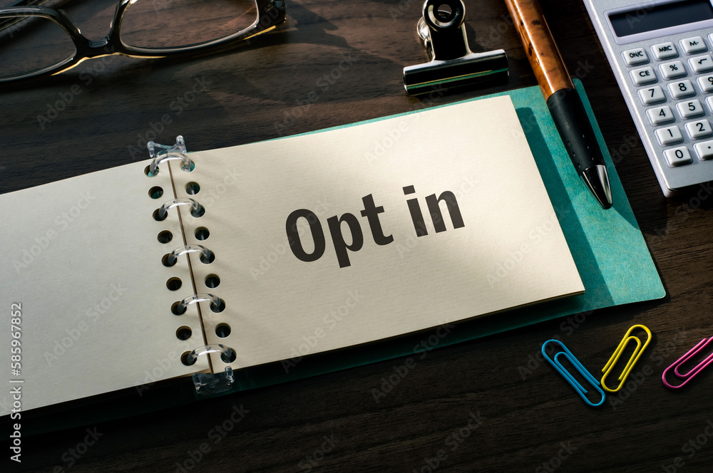 Poster there is a notebook with the word opt in. it is eye-catching image.