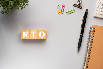 There is wood cube with the word RTO.It is an abbreviation for Recovery Time Objective as eye-catching image.
