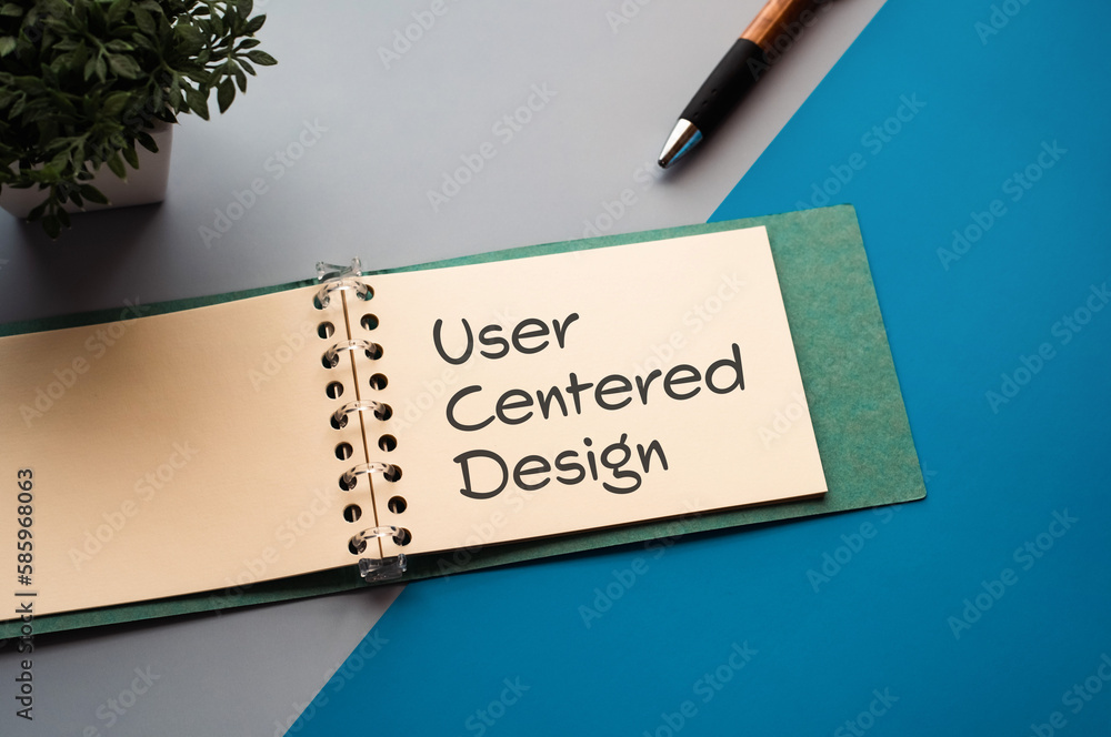 Poster there is a notebook with the word user centered design. it is eye-catching image.